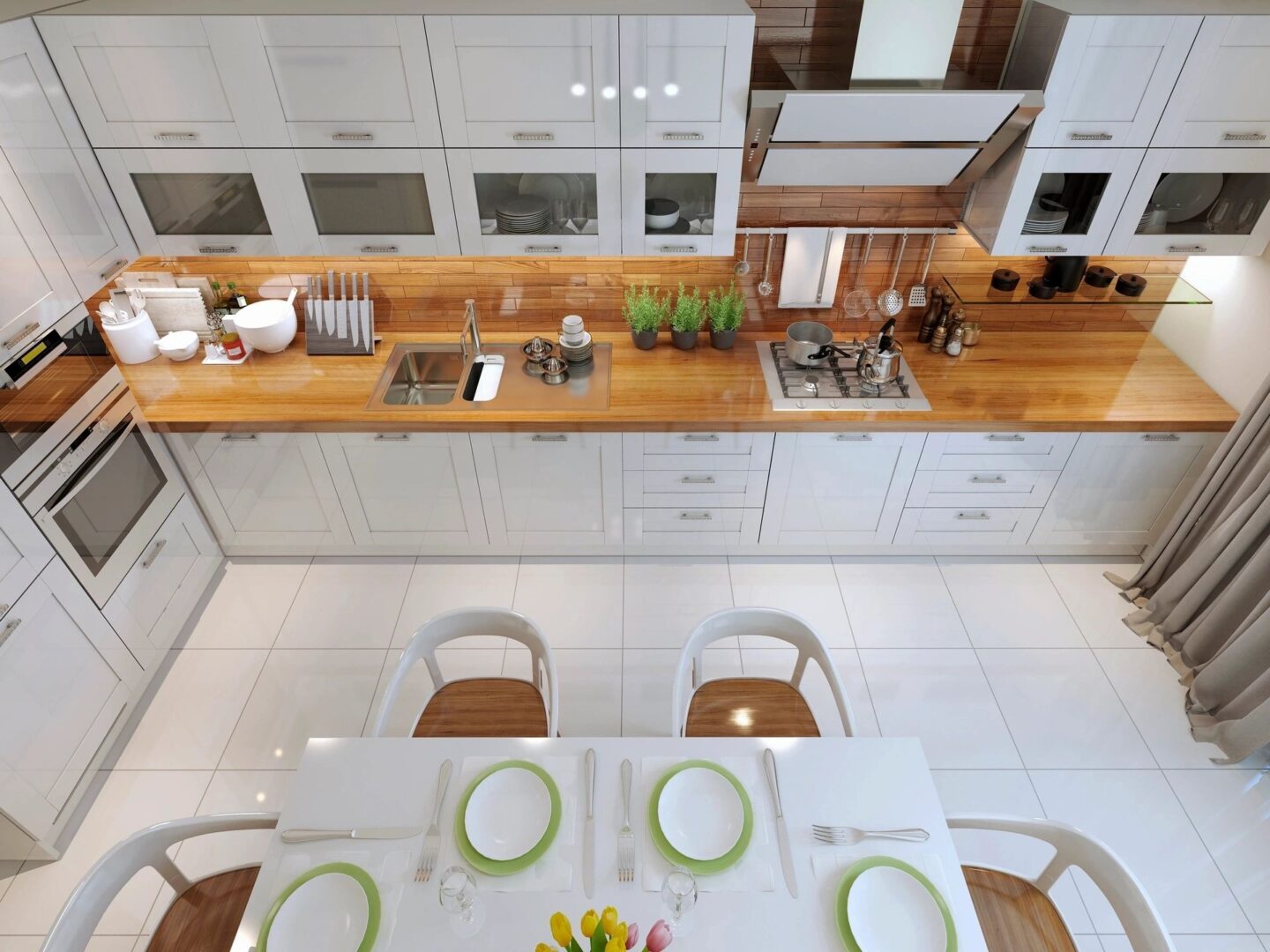 A kitchen with white cabinets and green plates