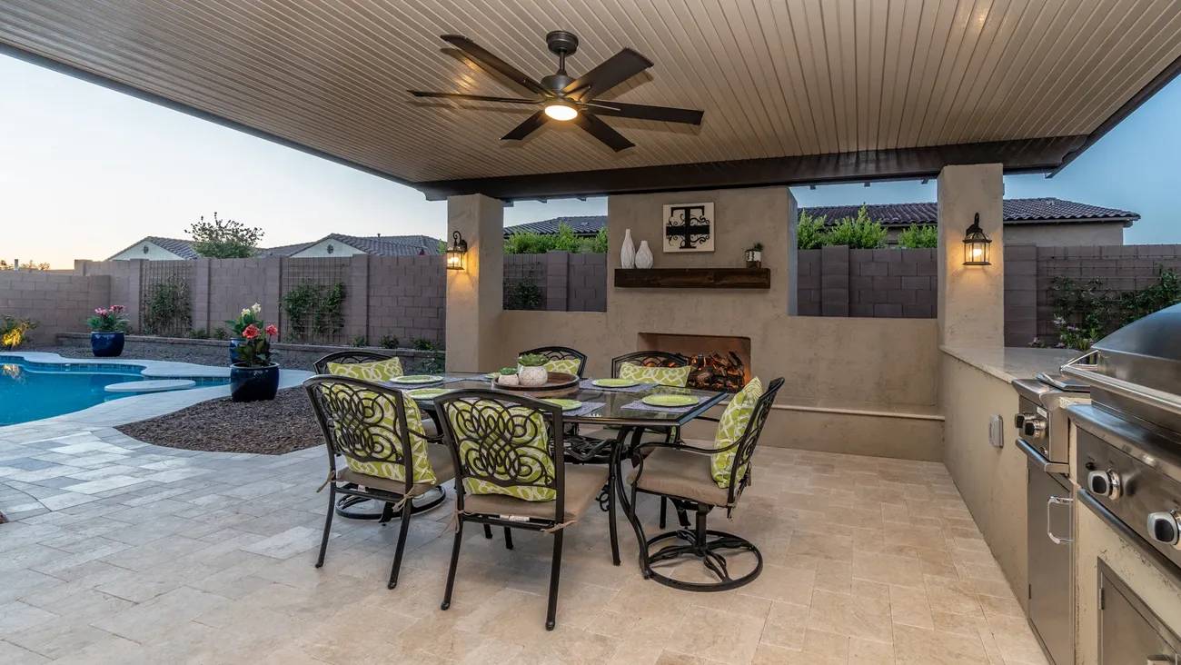 A patio with chairs and tables in it