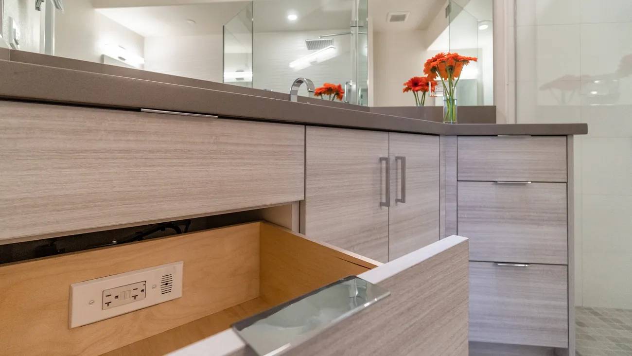 A kitchen with a sink and cabinets in it