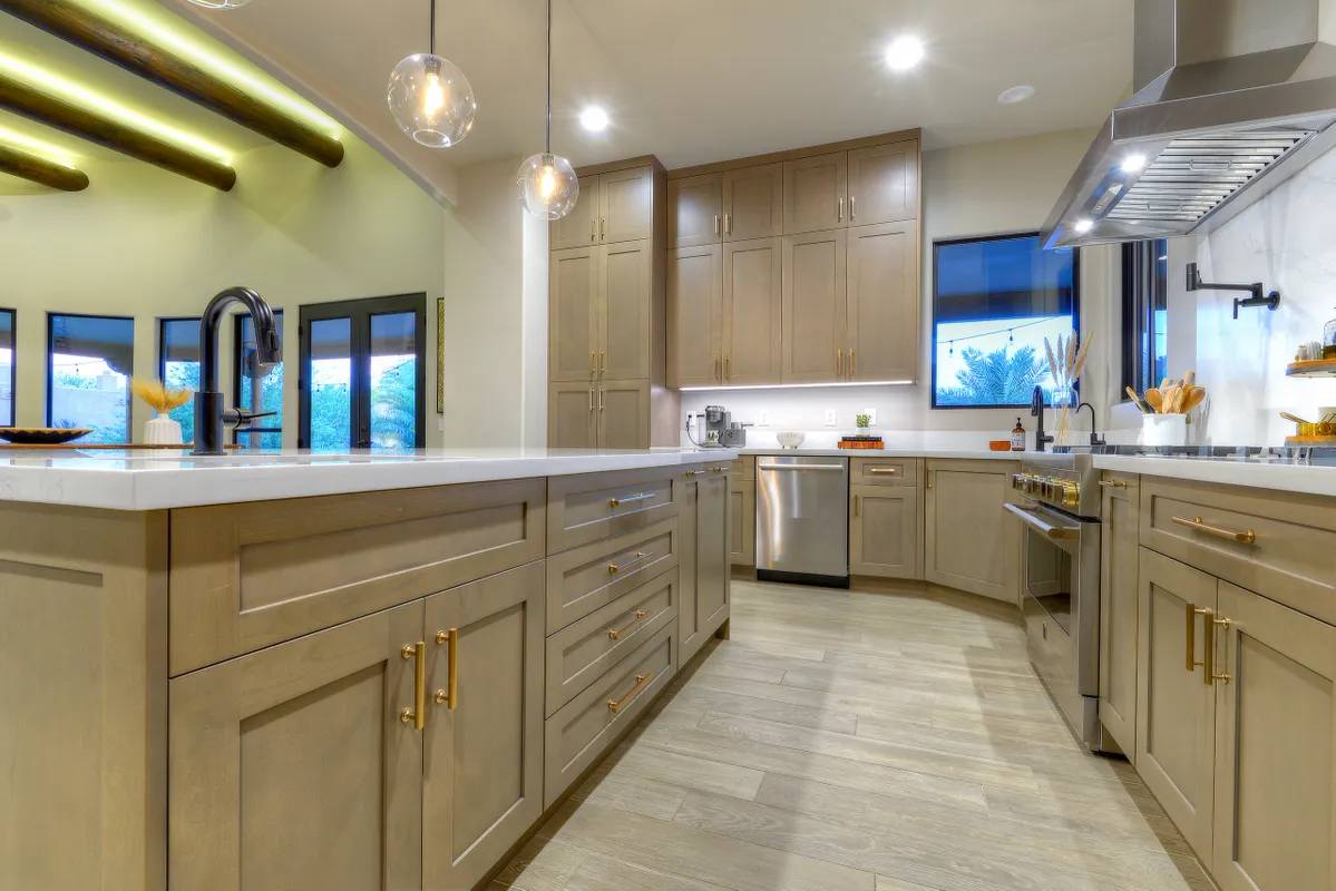 A kitchen with a large island and lots of counter space.