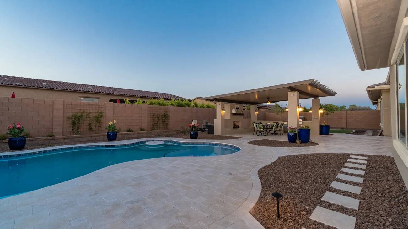 A pool with an umbrella shade over it