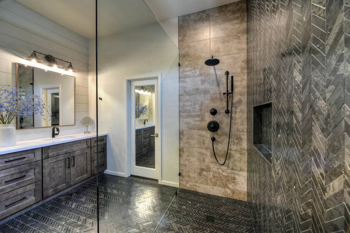 A bathroom with a shower and a sink